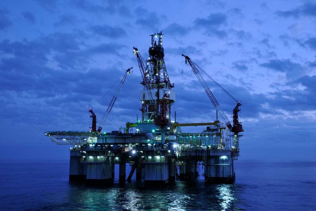 Offshore oil drilling platform at twilight